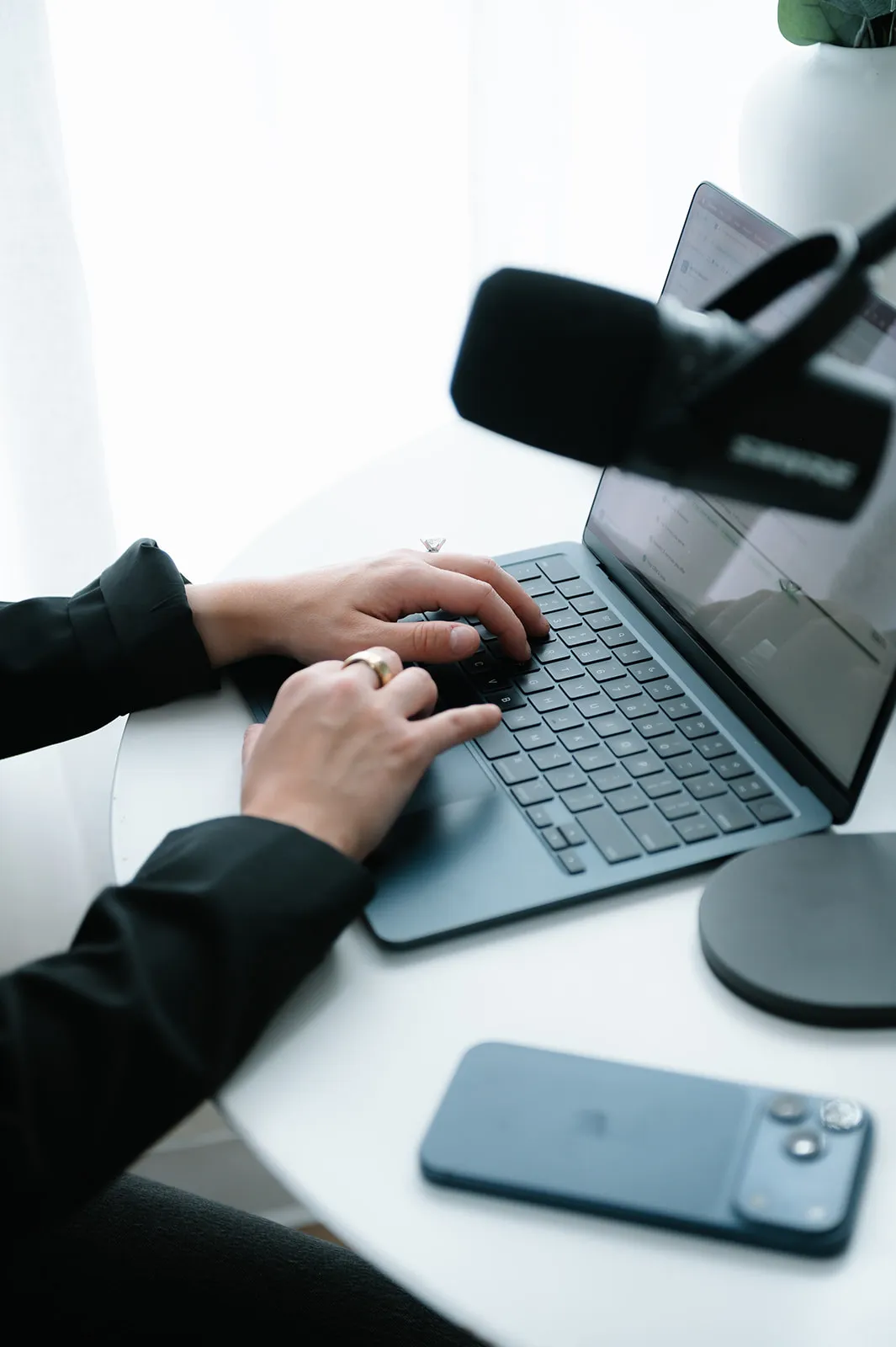 Brooke Kennison typing on a laptop at her desk