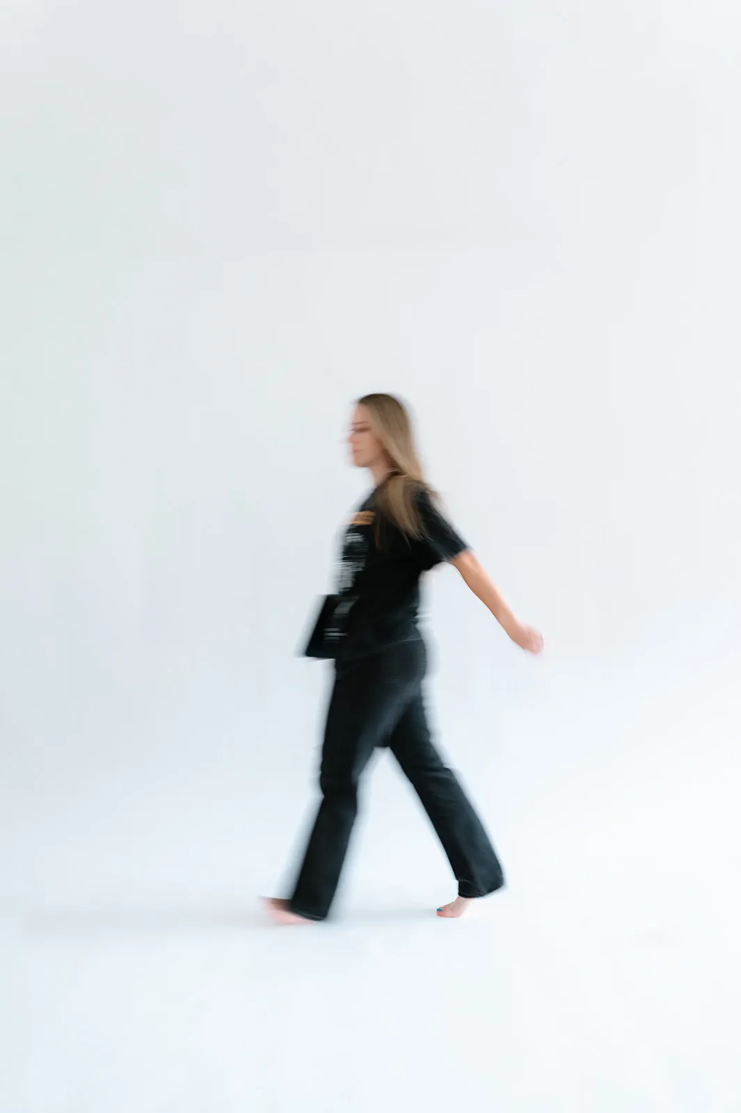 Brooke Kennison walking across the At The Meridian studio
